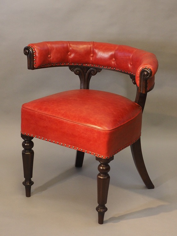 Red leather upholstered Early Victorian 'cockfighting' chair